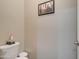 Clean and simple bathroom with toilet and small vanity at 19731 N Ben Ct, Maricopa, AZ 85138