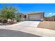 Single story home with a two-car garage and well-manicured landscaping at 19731 N Ben Ct, Maricopa, AZ 85138
