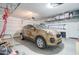 Garage with car and overhead storage at 19731 N Ben Ct, Maricopa, AZ 85138