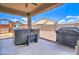 Covered patio with hot tub and grill at 19731 N Ben Ct, Maricopa, AZ 85138