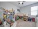 bedroom with bunk bed, toy storage, and plenty of natural light at 19731 N Ben Ct, Maricopa, AZ 85138