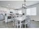 Bright kitchen with white cabinets, granite countertops, and an island at 19731 N Ben Ct, Maricopa, AZ 85138