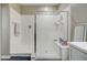 Walk-in shower with built-in bench and modern fixtures at 19731 N Ben Ct, Maricopa, AZ 85138
