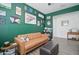 Spacious home office with a brown couch and gallery wall at 19731 N Ben Ct, Maricopa, AZ 85138