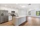 Modern kitchen with white cabinets, stainless steel appliances, and an island at 16844 E Ave Of The Fountains -- # 201, Fountain Hills, AZ 85268