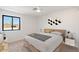 Light and airy bedroom with wood bed frame and window at 16844 E Ave Of The Fountains -- # 201, Fountain Hills, AZ 85268