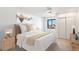 Cozy bedroom with double bed, nightstands, and window views at 16844 E Ave Of The Fountains -- # 201, Fountain Hills, AZ 85268