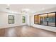 Spacious living area featuring hardwood floors and large window at 16844 E Ave Of The Fountains -- # 201, Fountain Hills, AZ 85268