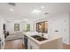 Modern kitchen with island and open living area at 16844 E Ave Of The Fountains -- # 201, Fountain Hills, AZ 85268