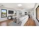 Open living space with hardwood floors, modern kitchen, and large windows at 16844 E Ave Of The Fountains -- # 202, Fountain Hills, AZ 85268