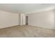 Simple bedroom with carpeted floor and neutral colored walls at 17214 W Gibson Ln, Goodyear, AZ 85338