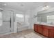 Elegant bathroom with a soaking tub, shower, and double vanity at 17214 W Gibson Ln, Goodyear, AZ 85338