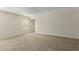 Bright bedroom with ample space and neutral colored carpet at 17214 W Gibson Ln, Goodyear, AZ 85338