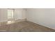 Clean hallway with tile flooring and neutral colored walls at 17214 W Gibson Ln, Goodyear, AZ 85338