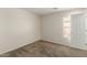 Simple bedroom with carpeted floor and neutral wall colors at 17214 W Gibson Ln, Goodyear, AZ 85338