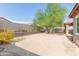 Landscaped backyard with desert plants and a grassy area at 17214 W Gibson Ln, Goodyear, AZ 85338