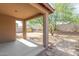 Covered patio overlooking a desert landscape backyard at 17214 W Gibson Ln, Goodyear, AZ 85338