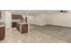 Open kitchen with island, stainless steel appliances, and ample cabinetry at 17214 W Gibson Ln, Goodyear, AZ 85338