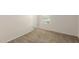 Simple bedroom with neutral walls and carpet at 17214 W Gibson Ln, Goodyear, AZ 85338
