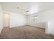 Spacious bedroom with neutral carpet and ceiling fan at 2084 N 214Th Dr, Buckeye, AZ 85396