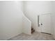 Bright entryway with tiled floor and staircase at 2084 N 214Th Dr, Buckeye, AZ 85396
