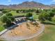 Community playground with play structures and swings at 2084 N 214Th Dr, Buckeye, AZ 85396