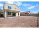 Large backyard with gravel and covered patio at 2084 N 214Th Dr, Buckeye, AZ 85396