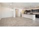 Open concept kitchen with island, stainless steel appliances, and dark cabinetry at 2084 N 214Th Dr, Buckeye, AZ 85396