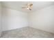 Simple bedroom with ceiling fan and neutral color scheme at 2084 N 214Th Dr, Buckeye, AZ 85396