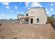 Large backyard with gravel landscaping and a two-story house at 2084 N 214Th Dr, Buckeye, AZ 85396