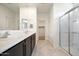 Spacious bathroom boasting double sinks, a walk-in shower, and ample storage at 2084 N 214Th Dr, Buckeye, AZ 85396