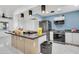 Open concept kitchen with island and stainless steel appliances at 131 W Tulsa St, Chandler, AZ 85225