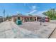 Single story home with carport, gravel driveway, and mature trees at 131 W Tulsa St, Chandler, AZ 85225