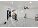 Open concept living room and kitchen with white walls and tile floors at 131 W Tulsa St, Chandler, AZ 85225