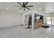Open concept living room and kitchen with tile floors and ceiling fan at 131 W Tulsa St, Chandler, AZ 85225