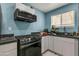 Modern kitchen with stainless steel appliances and granite countertops at 131 W Tulsa St, Chandler, AZ 85225