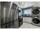 Updated kitchen featuring stainless steel appliances and laundry in unit at 131 W Tulsa St, Chandler, AZ 85225