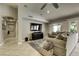 Spacious living room with large sectional sofa and tile flooring at 9904 E Monterey Ave, Mesa, AZ 85209