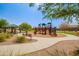 Community playground with play structures and shaded seating at 4809 E Fire Opal Ln, San Tan Valley, AZ 85143