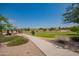 Community park with walking path, playground, and open green space at 4809 E Fire Opal Ln, San Tan Valley, AZ 85143