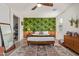 Bright bedroom with a tropical-themed wall and wooden bed frame at 4809 E Fire Opal Ln, San Tan Valley, AZ 85143