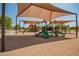 Shaded playground with slides and play structures at 4809 E Fire Opal Ln, San Tan Valley, AZ 85143