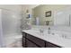 Clean bathroom with a bathtub, toilet, and dark brown vanity at 4809 E Fire Opal Ln, San Tan Valley, AZ 85143