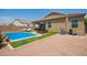 Clean lines and refreshing blue pool in backyard at 4809 E Fire Opal Ln, San Tan Valley, AZ 85143