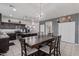 Modern kitchen with dark cabinetry, granite countertops, and stainless steel appliances at 4809 E Fire Opal Ln, San Tan Valley, AZ 85143