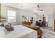 Bright bedroom with large windows, workspace and a comfortable bed at 4809 E Fire Opal Ln, San Tan Valley, AZ 85143