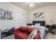 Small bedroom with a red couch and a world map on the wall at 4809 E Fire Opal Ln, San Tan Valley, AZ 85143