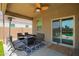 Relaxing covered patio with fire pit and seating area at 4809 E Fire Opal Ln, San Tan Valley, AZ 85143
