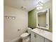 Updated bathroom with a modern vanity and stylish light fixture at 4423 E Ponca St, Phoenix, AZ 85044