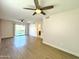 Bright and airy living area with wood-look floors and access to backyard at 4423 E Ponca St, Phoenix, AZ 85044